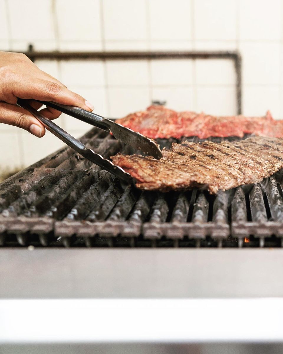 Steak searing on the kitchen grill